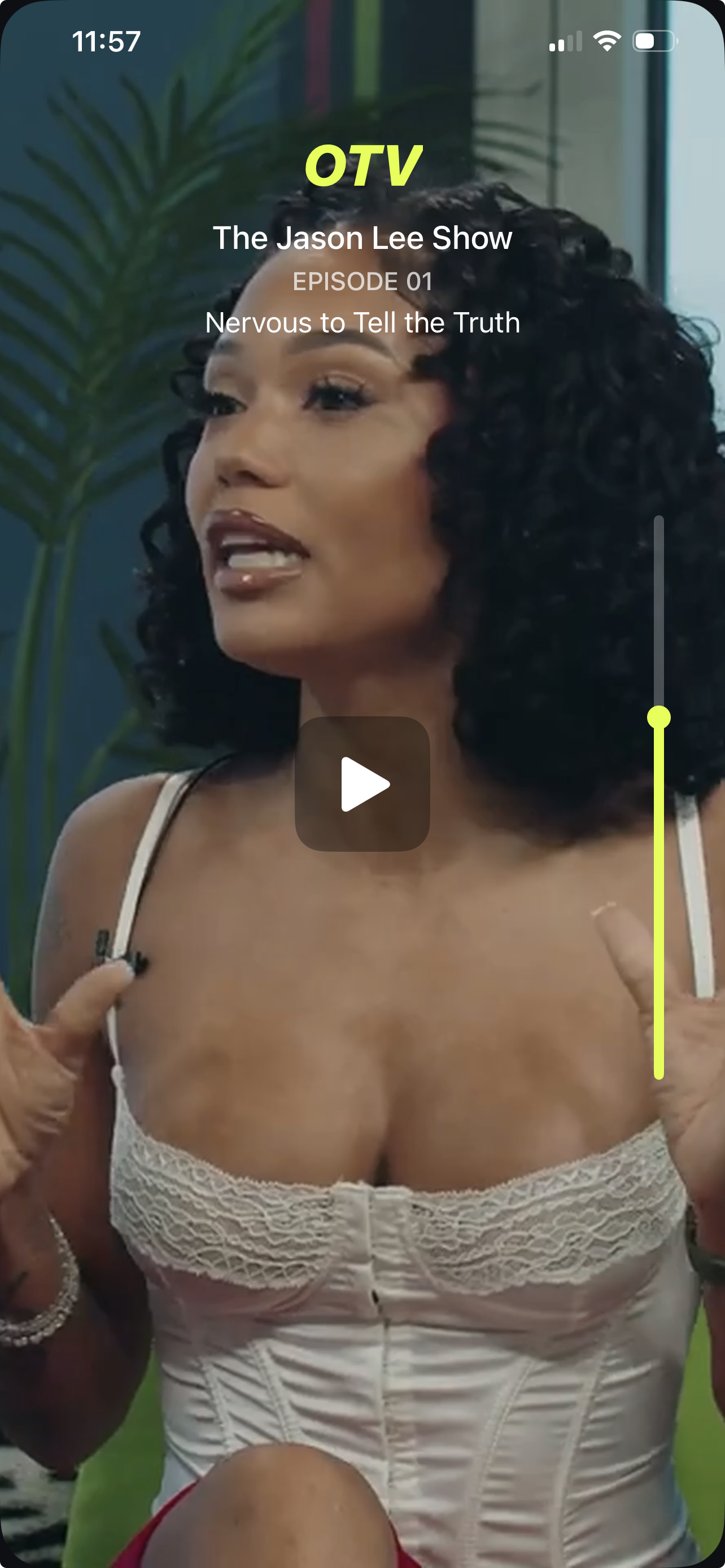 Paused vertical player with controls visible.